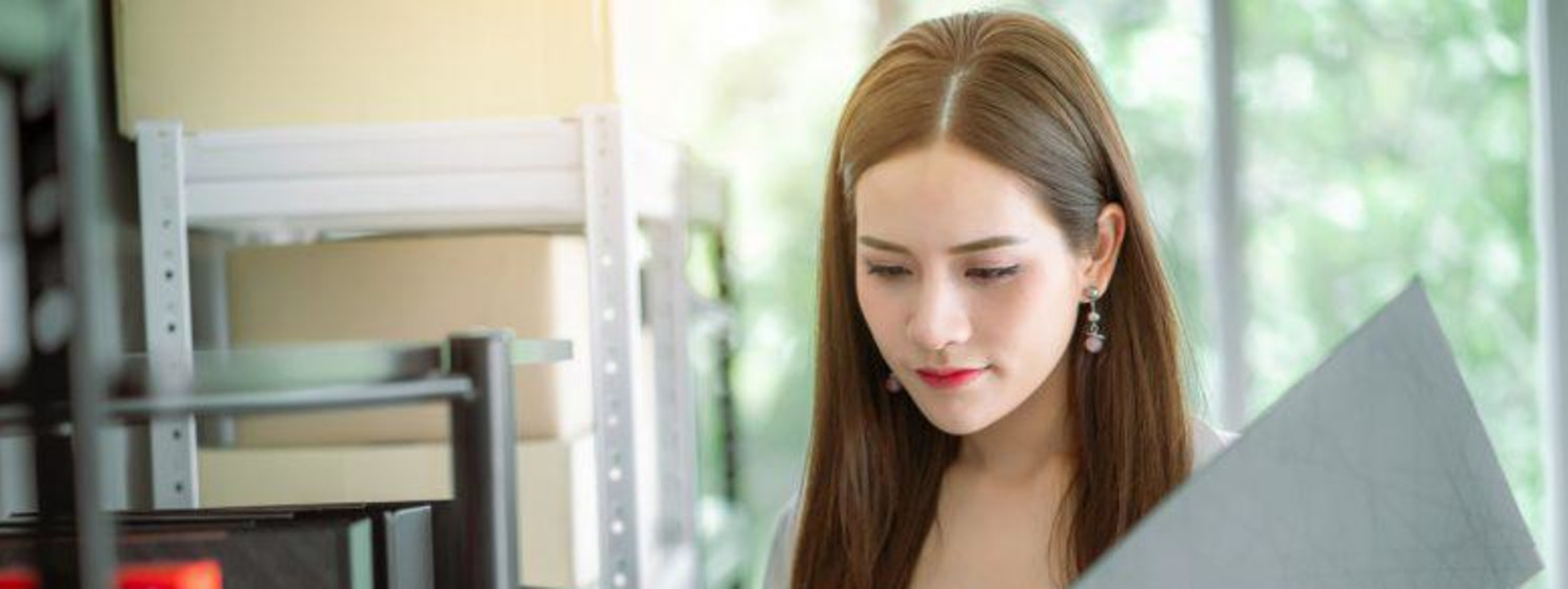 Woman looking through a binder