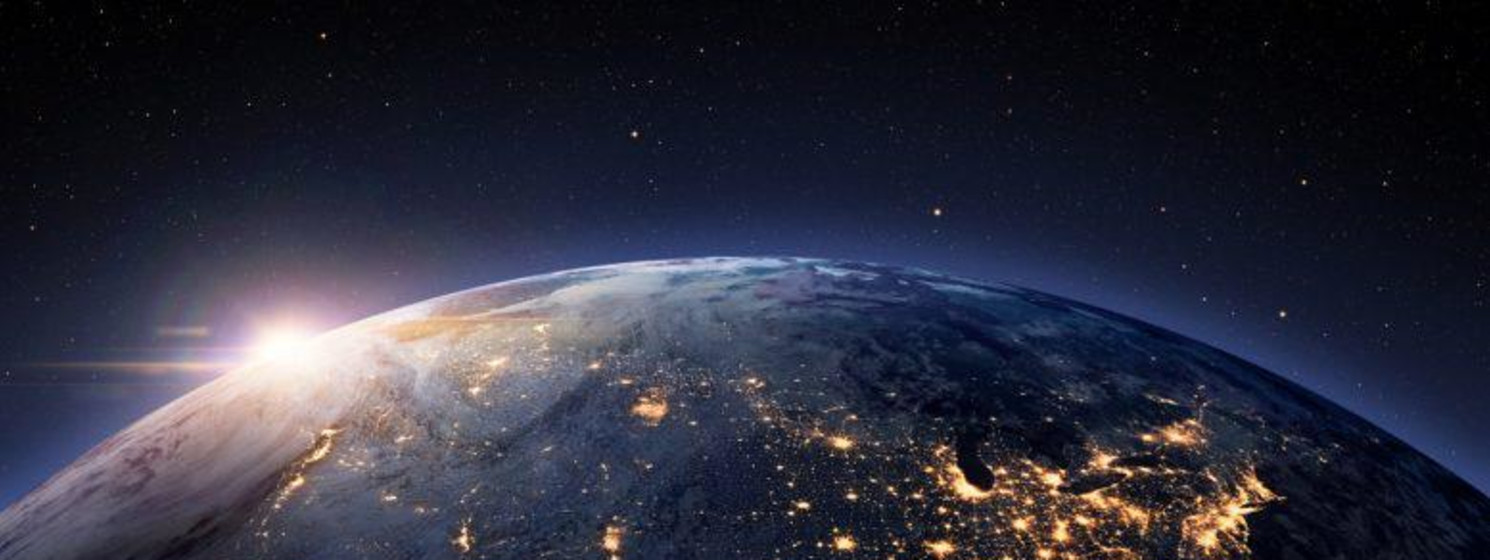Space view of the US lit up with the sun in the northwest horizon
