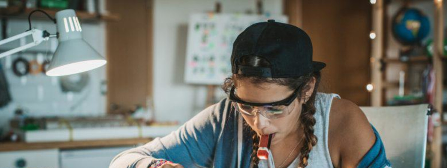A STEM student working at her desk