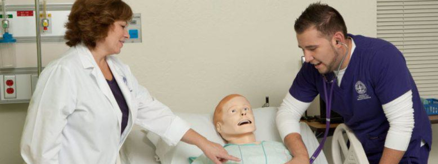 nursing student working with a doctor