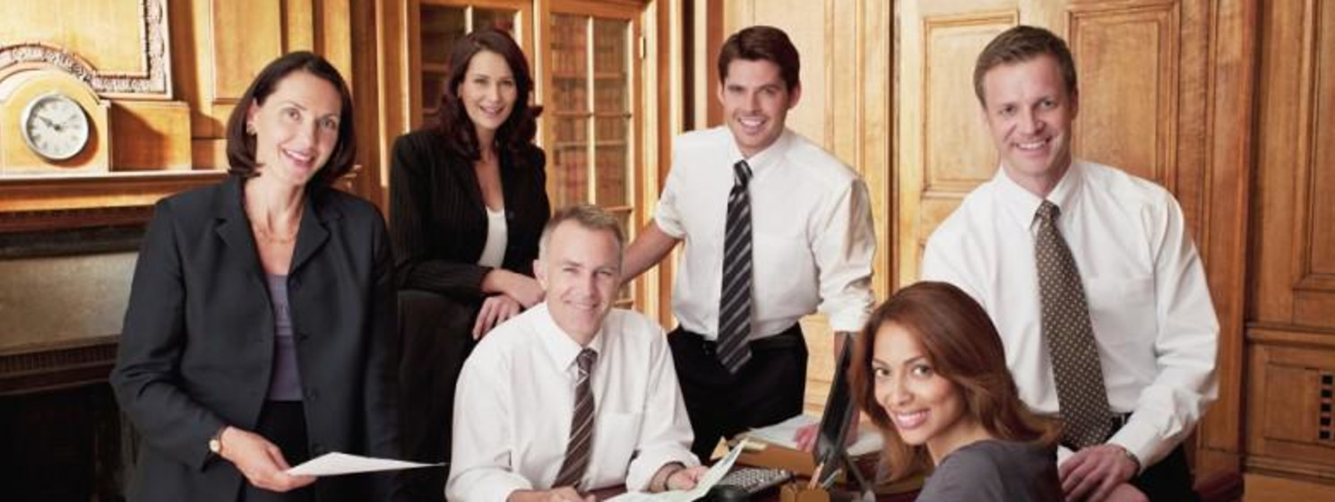 six lawyers looking over files
