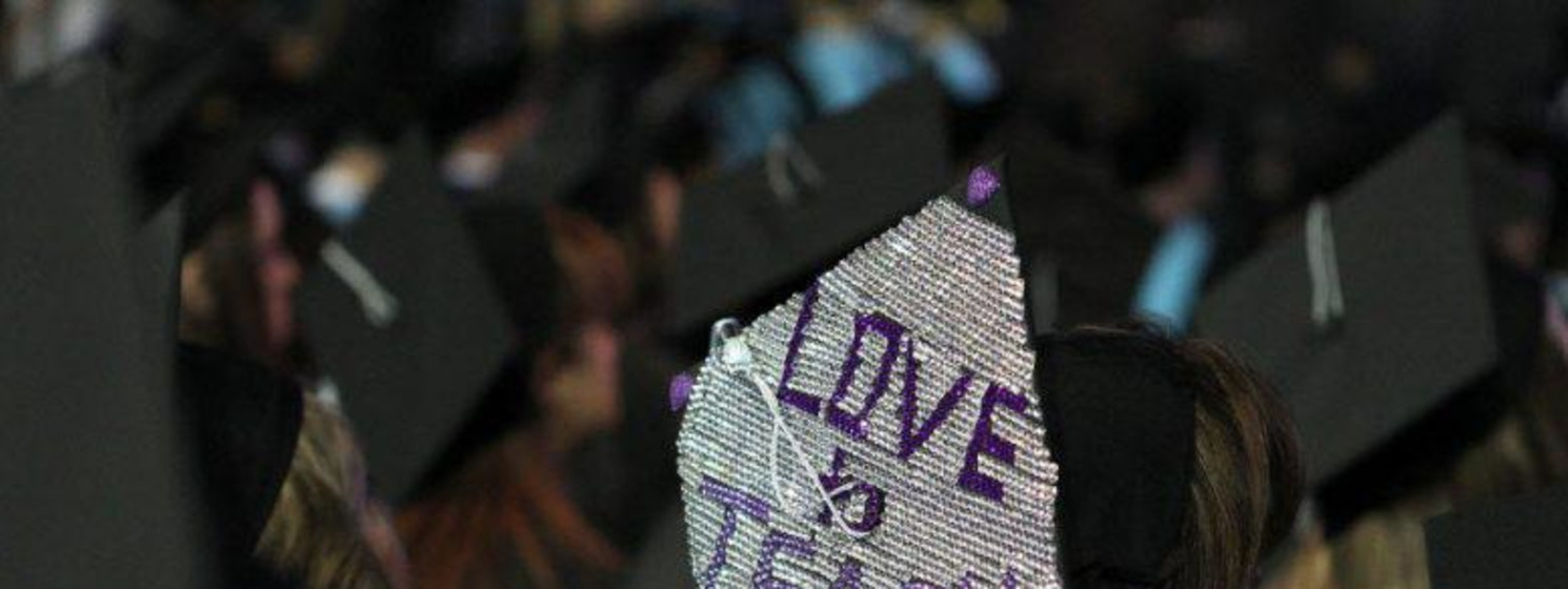 graduation cap that says love to teach
