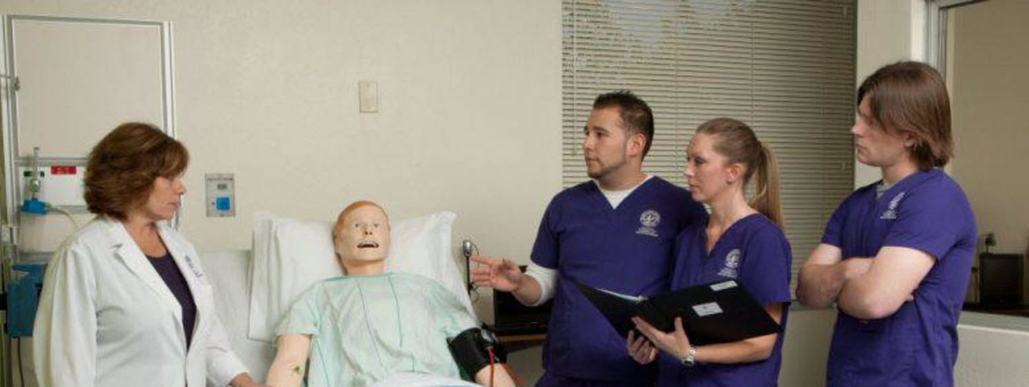 Nursing students learn patient techniques in a clinical setting