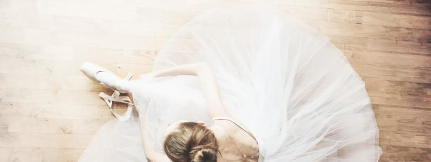 Ballerina putting on shoes