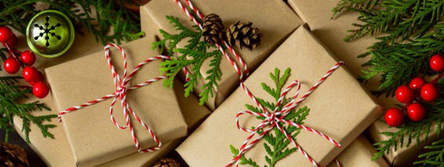 A group of wrapped presents under the tree