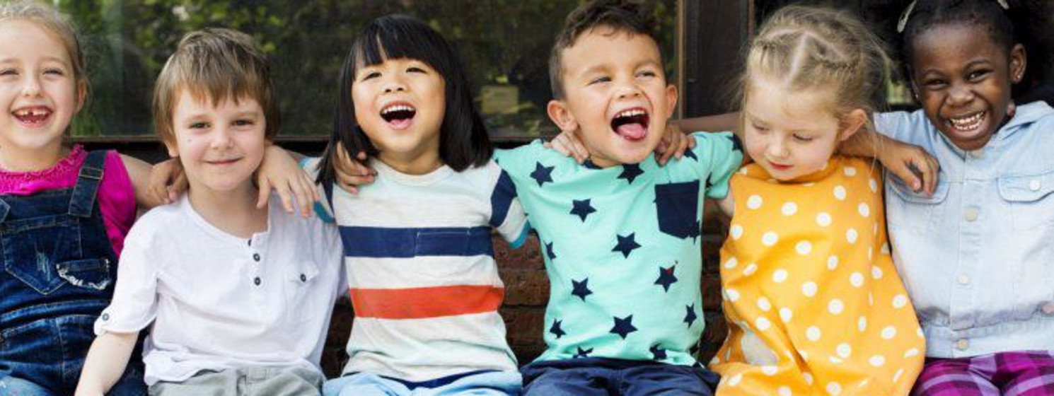 Children with their arms around eachother