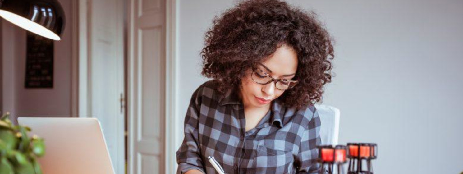 girl writing at a desk