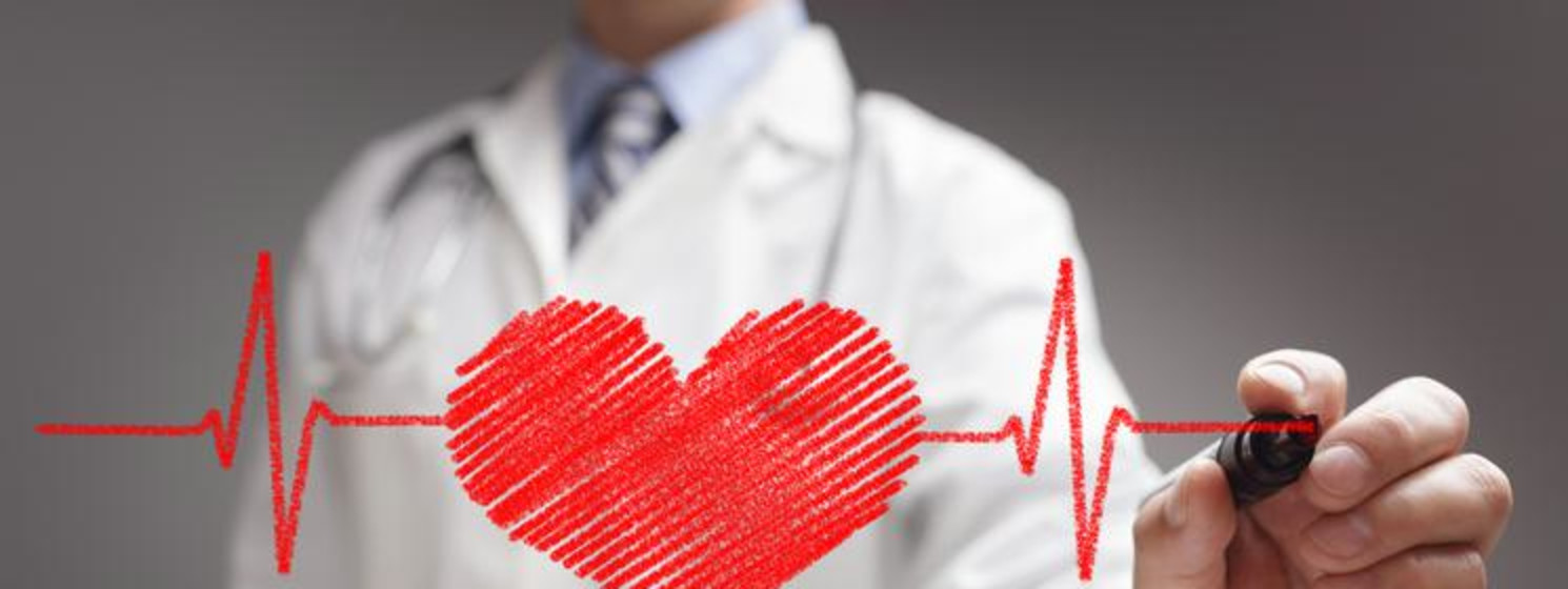 doctor drawing a heart and lines on a see-through board