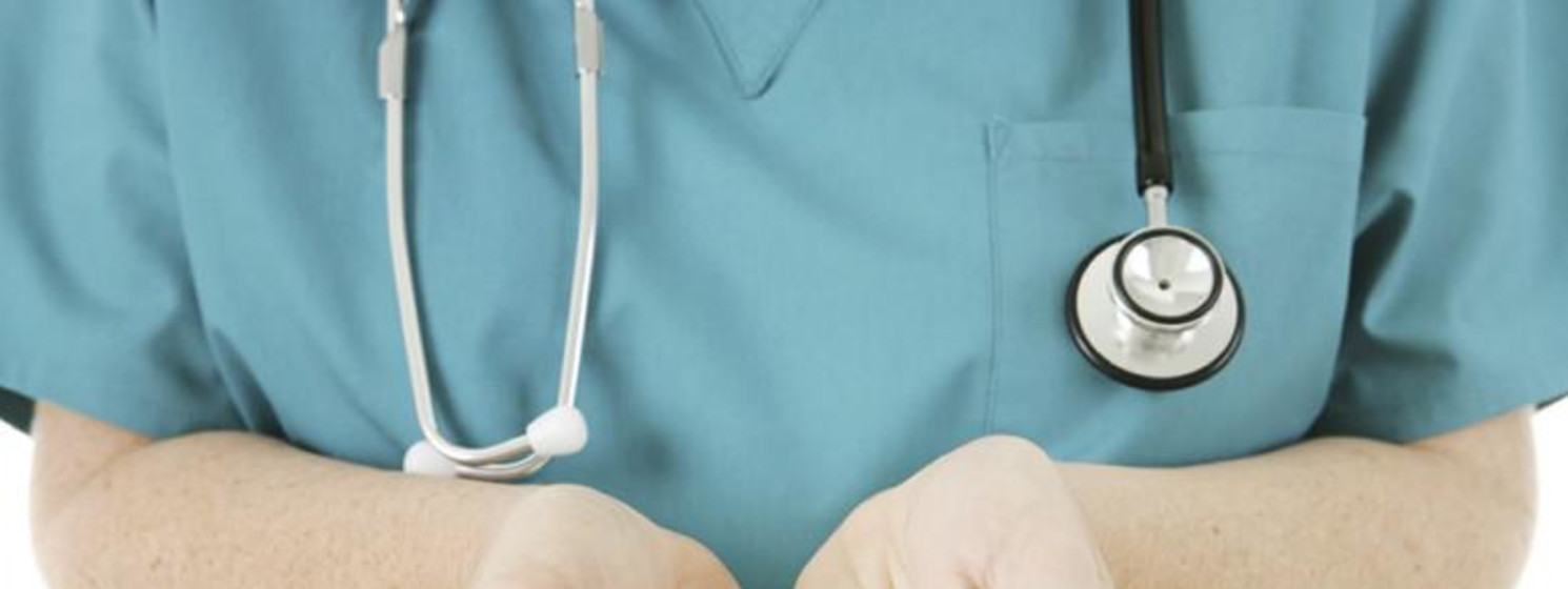 nurse holding a cross in hands