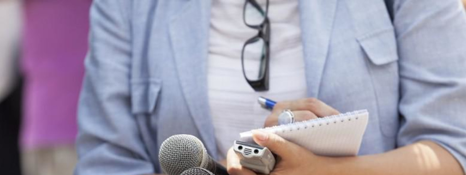 journalist writing things down
