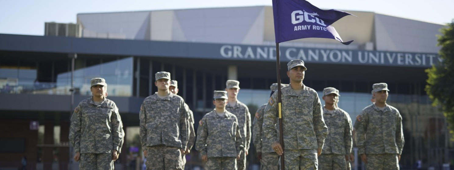 army students standing in front of the GCU Arena