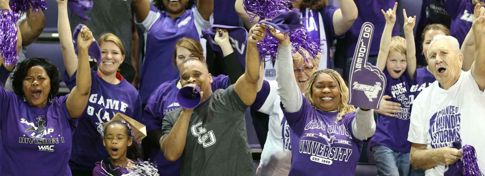 alumni fans cheering at a game