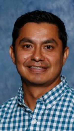 Dr. Sammy Alfaro posing for a headshot