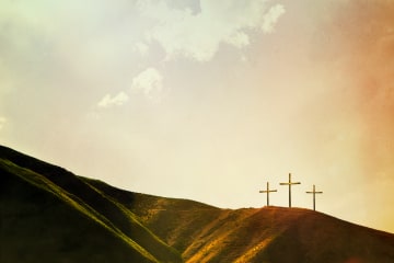 Three crosses on a hillside