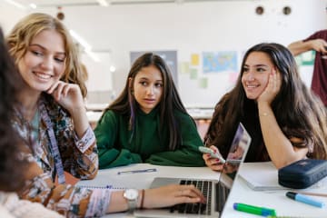 A group of students collaborating with one another