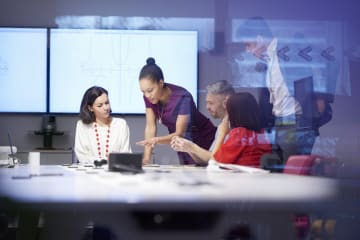 A leader giving instruction during a team meeting