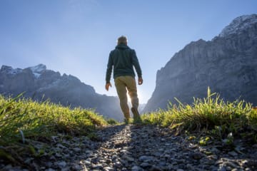 man standing in nature looking forward