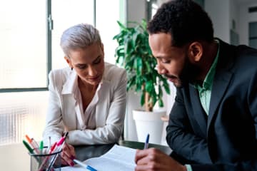 Criminal justice professionals discussing a case