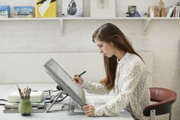 a graphic designer working in her home office