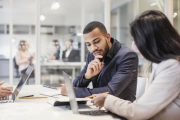 Business people having a meeting and going over documents