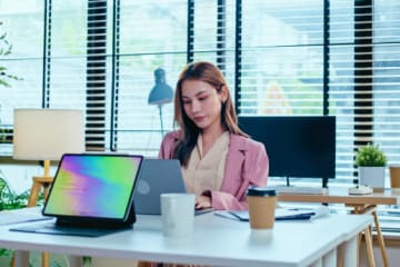 Woman working at desk.