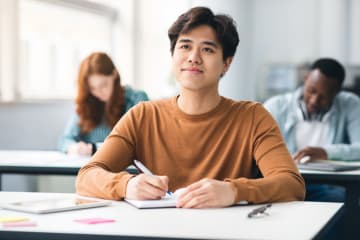 Student contemplates his studies.