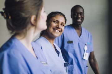 a group of smiling nurses
