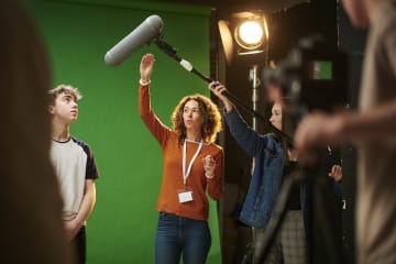 Film students in front of a green screen