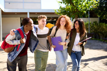 small group of students walking and laughing