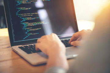 Someone coding at their desk