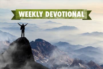 man standing on top of a hill with weekly devotional banner above