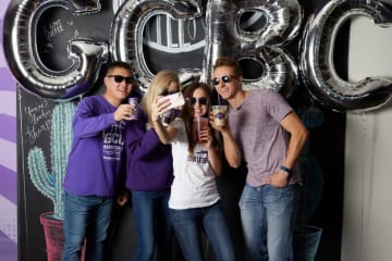 students holding coffee