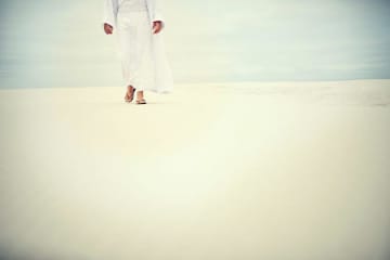 Jesus walking on sand