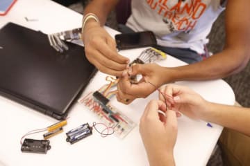 hands working with wires