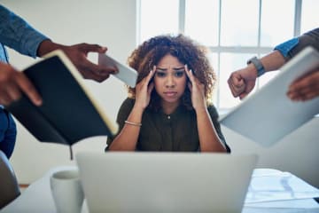 person putting hands on head stressed out
