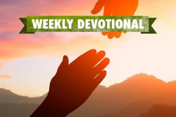 Weekly Devotional: Two hands reaching for each other