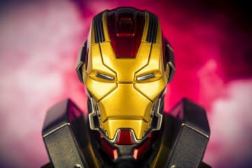 An Iron Man helmet surrounded by red smoke