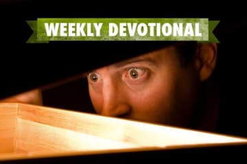 person looking in glowing box