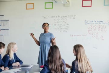 a teacher teaching math to her class