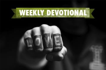 Weekly Devotional: Black and White fist with word love