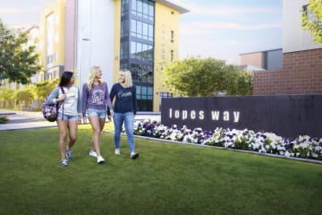 three GCU students walking on lopes way