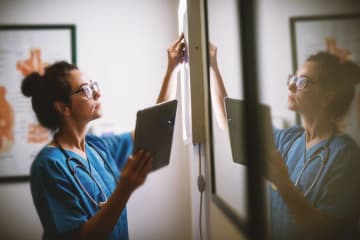 Nurse working with a tablet