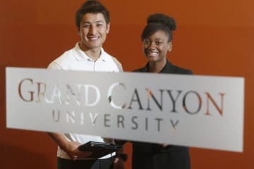 two GCU students smiling