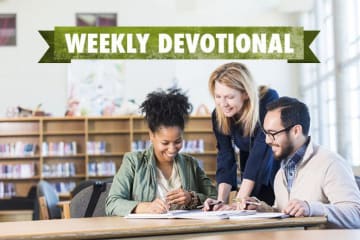 woman helping student