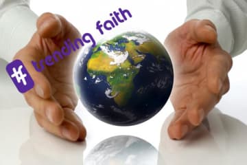 hands around globe