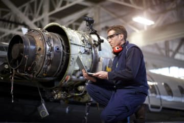 Man working on airplane