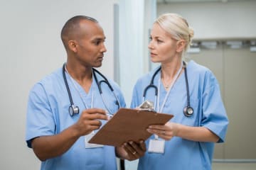 two nurses talking