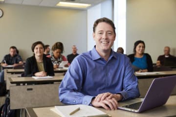 An adult learner in a GCU classroom