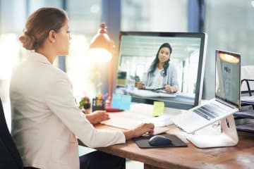 Professional woman video chats with another professional woman