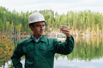 hydrologist collecting water to check environmental health